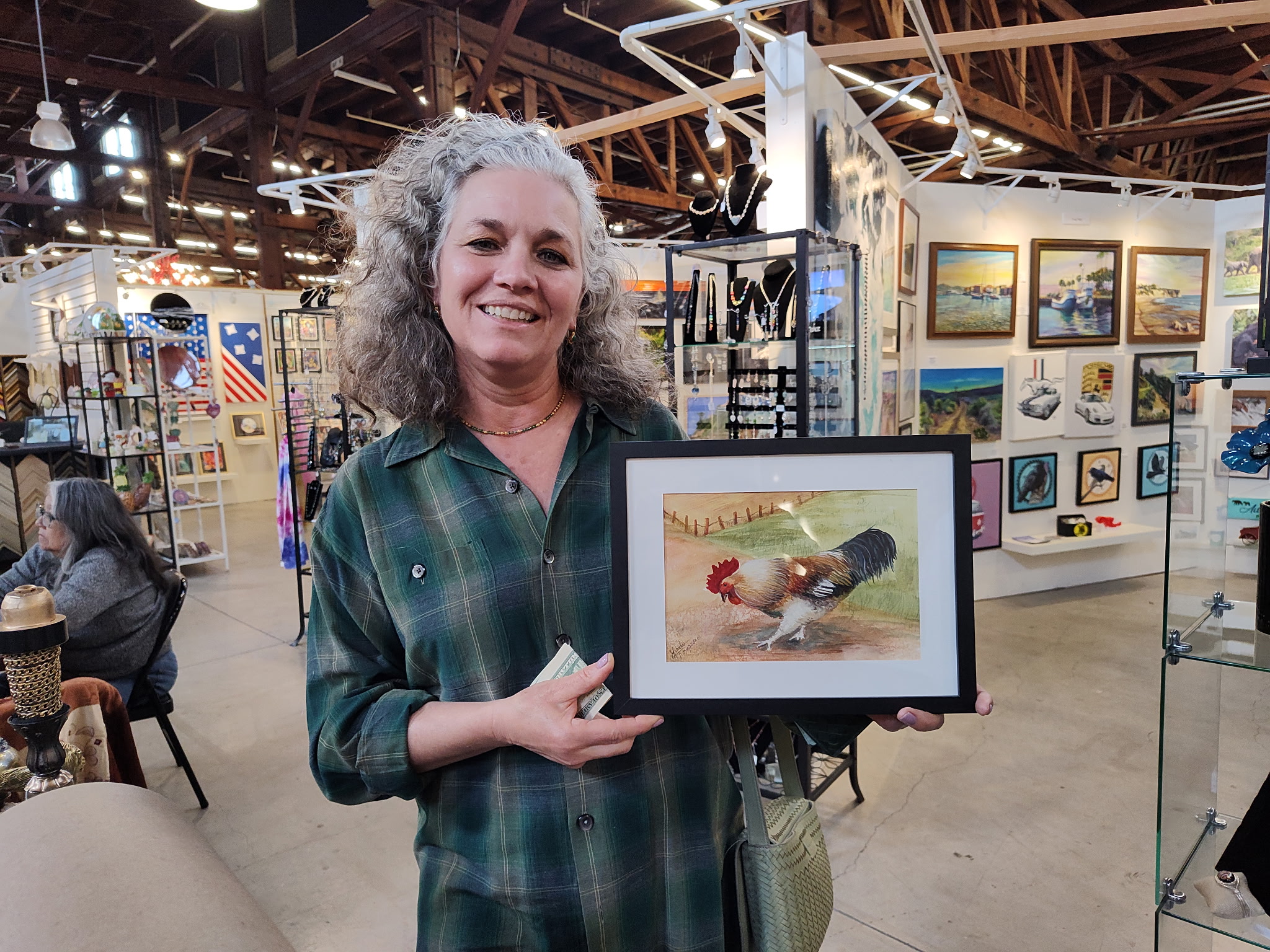 Person holding painting