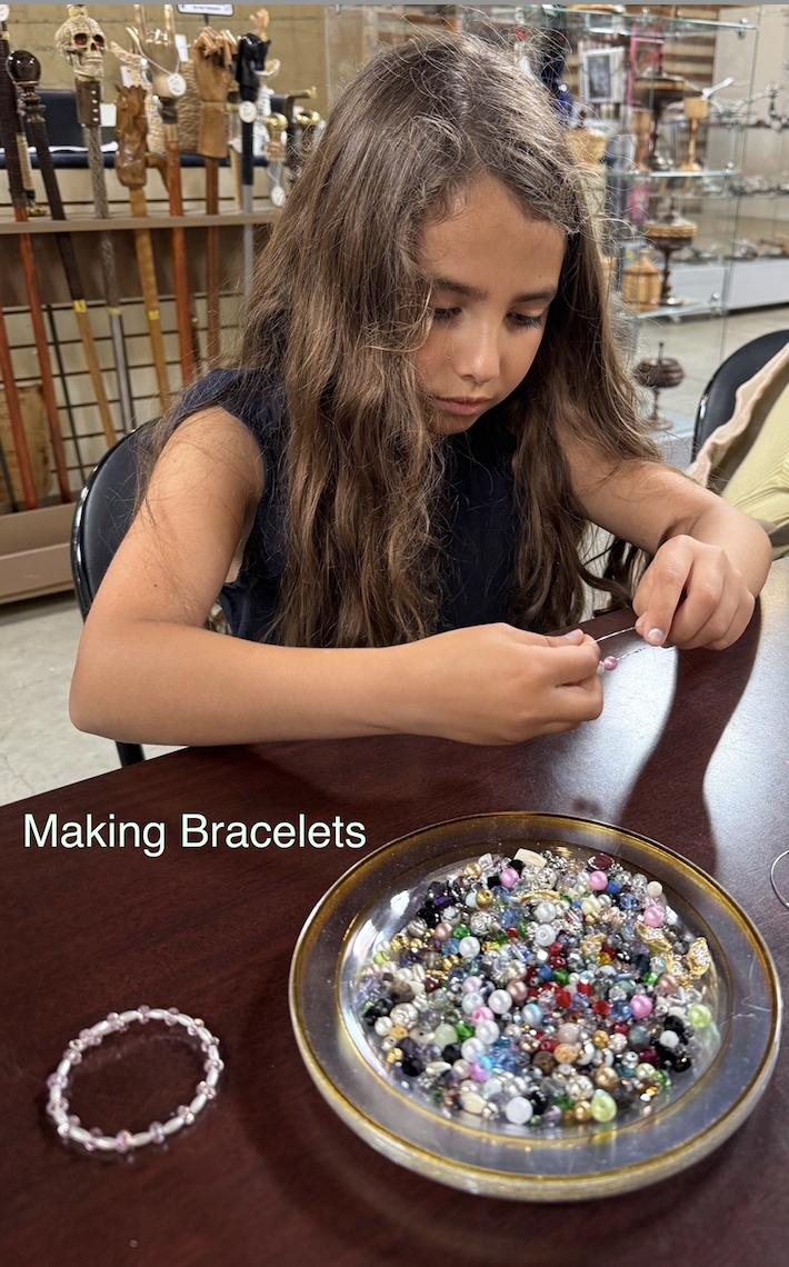 Child making jewelry